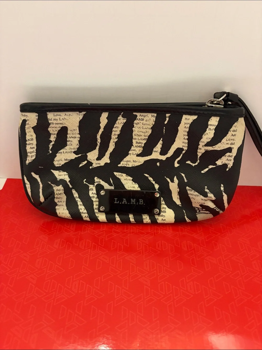 L.A.M.B. Black and Cream Zebra-Print Clutch with Logo Plate